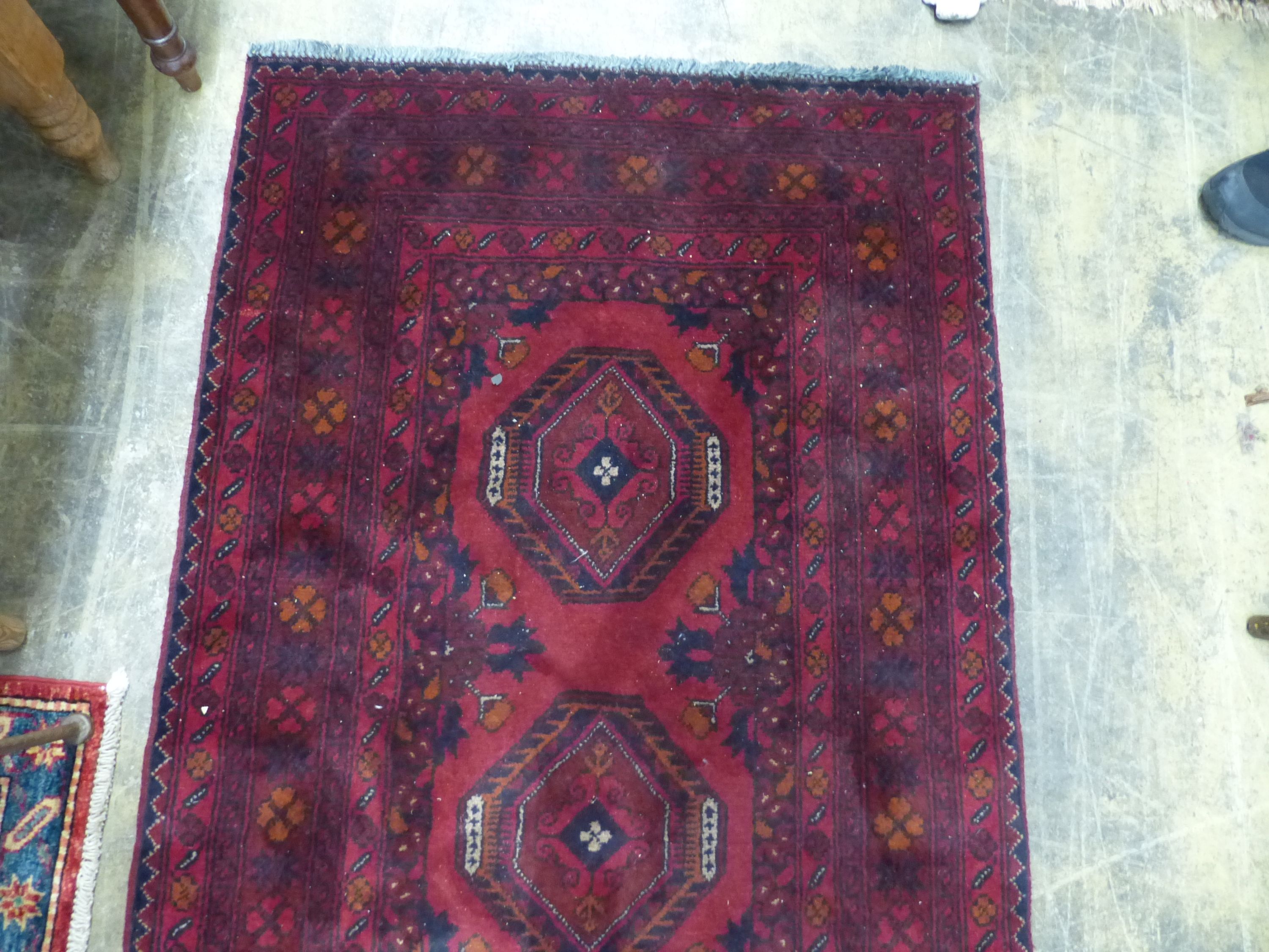 A Bokhara red ground runner, 290 x 82cm